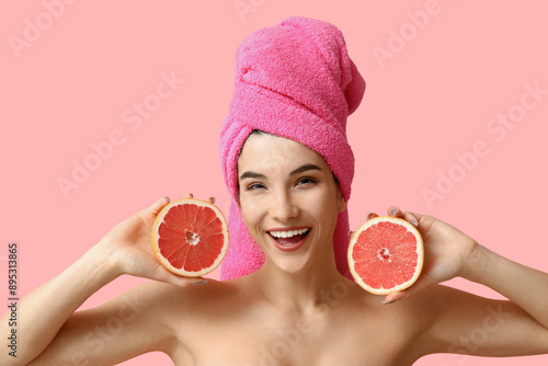 Happy young woman with pink...