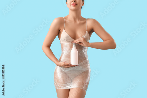Young woman in stretch film...