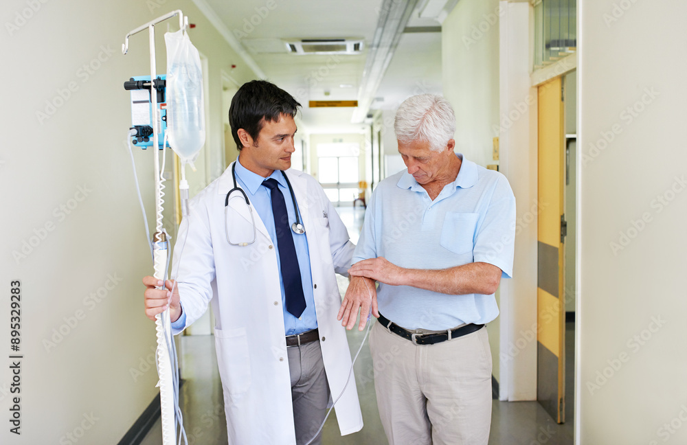 Hospital, walking and doctor with patient, IV drip and elderly person with serious for medical appointment. Clinic, communication and consultation for wellness, sick and talk for healthcare and work Hospital, walking and doctor with patient, IV drip and elderly person with serious for medical appointment. Clinic, communication and consultation for wellness, sick and talk for healthcare and work