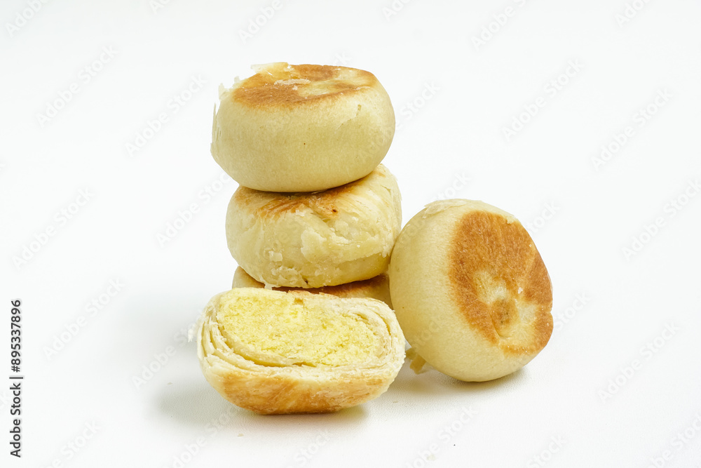 Bakpia, Bakpia Pathok kacang hijau is a food and souvenir typical of Yogyakarta made from a mixture of mung beans coated with flour. Isolated on white Bakpia, Bakpia Pathok kacang hijau is a food and souvenir typical of Yogyakarta made from a mixture of mung beans coated with flour. Isolated on white