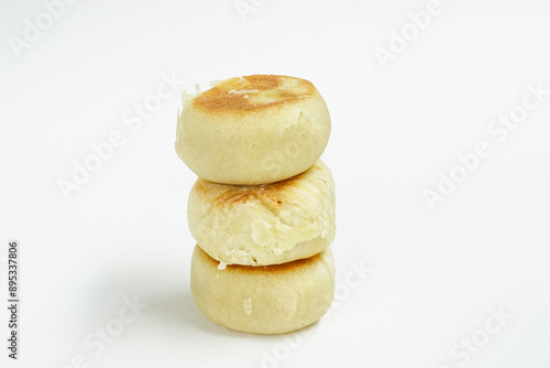 Bakpia is a food and souvenir typical of Yogyakarta made from a mixture of red beans or mung beans or cheese or yam coated with flour. That is an acculturation of Chinese culture. Isolated on white. photo