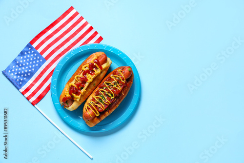 Wall Mural Plate with tasty hot dogs and USA flag on blue background