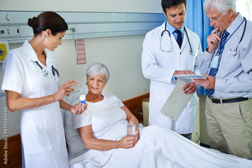 Obraz premium Hospital, pills and doctors with old woman, explaining or communication for health of patient or medical. Clinic, wellness and nurse with senior person, water or medicine in appointment of healthcare