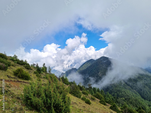 Beautiful mountain landscape in the Himalayas with a cloudy blue sky