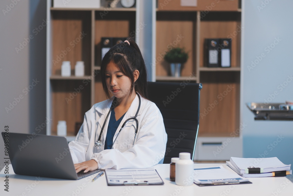 Female doctor holding white medicine bottle in hand at clinic, Healthcare and medical concept. Female doctor holding white medicine bottle in hand at clinic, Healthcare and medical concept.