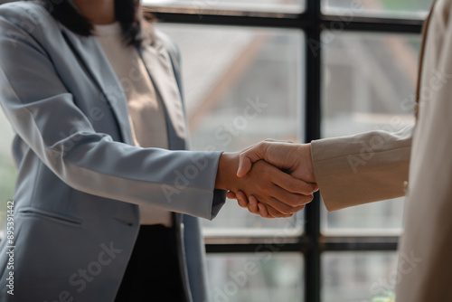Quadro su tela two big companies handshake because they agree on a business deal, businesspeopl