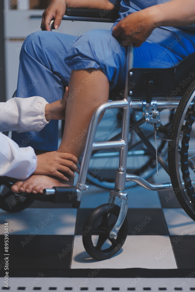 Obraz premium Asian young professional successful friendly female nurse in blue hospital uniform helping supporting physical therapy senior old pensioner unhealthy injury woman patient walking via four legs walker.