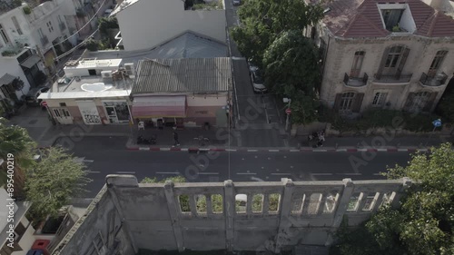 Narrow road near a colorful old buildings in Neve Tzedek Neighborhood in Tel Aviv - the area has been completely re-gentrified and Neve Tzedek is now one of Tel Aviv's trendiest districts (D-log) photo