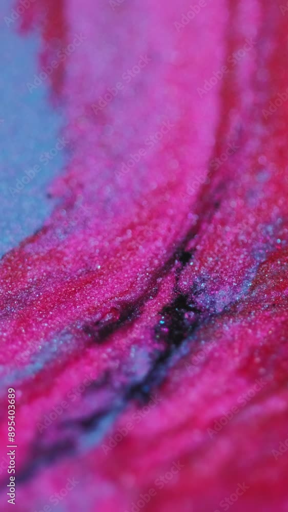 Vertical video. Glitter ink wave. Shimmering fluid. Blur vibrant magenta pink blue black color shiny particles paint mix flow motion abstract art background. Vertical video. Glitter ink wave. Shimmering fluid. Blur vibrant magenta pink blue black color shiny particles paint mix flow motion abstract art background.
