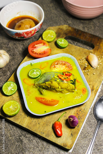 Ikan patin kuah kuning or catfish cooked in yellow sauce. Indonesian dishes have a savory and spicy taste