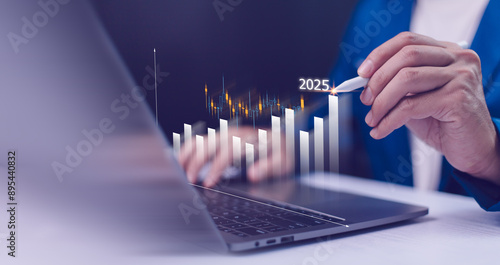 Obraz na płótnie 2024 to 2025 business financial plan market concept, performance of profit growth on 2024, education trend up finance on growth graph money revenue, Businessman analyzes profitability of working. w salonie