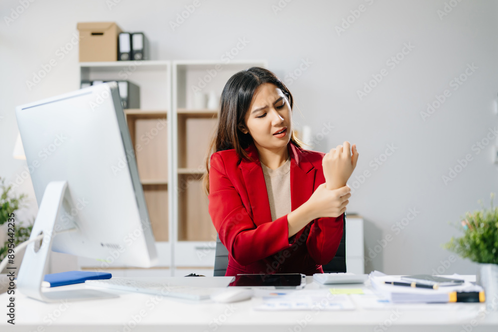 Overworked young Asian businesswoman office worker suffering from neck pain after had a long day at her office Overworked young Asian businesswoman office worker suffering from neck pain after had a long day at her office