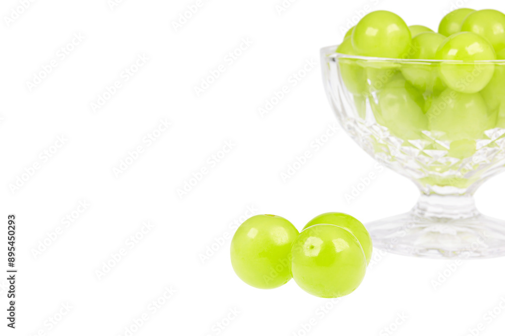 Fresh Shine Muscat grapes filled in a dessert bowl. white background - vitis vinifera 'shine muscat' Fresh Shine Muscat grapes filled in a dessert bowl. white background - vitis vinifera 'shine muscat'