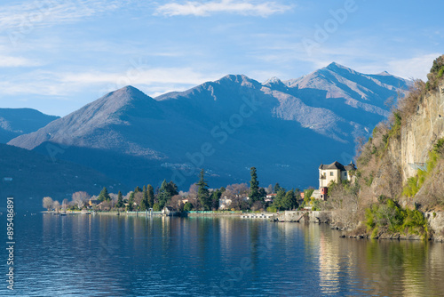 Lake Maggiore with the lakeside of the town of Maccagno, Italy. To the right the Madonna della Punta sanctuary