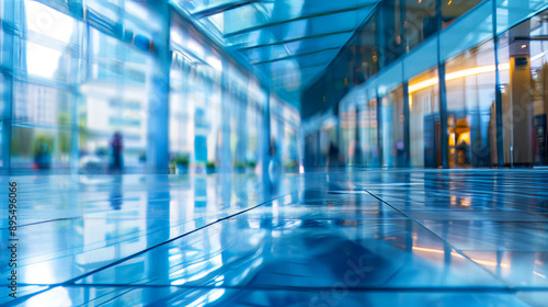 Blue glass windows in a modern building with a blurred background create an abstract effect. © Orxan