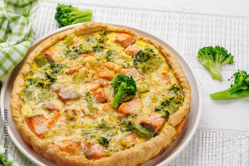 Homemade pie with salmon and broccoli