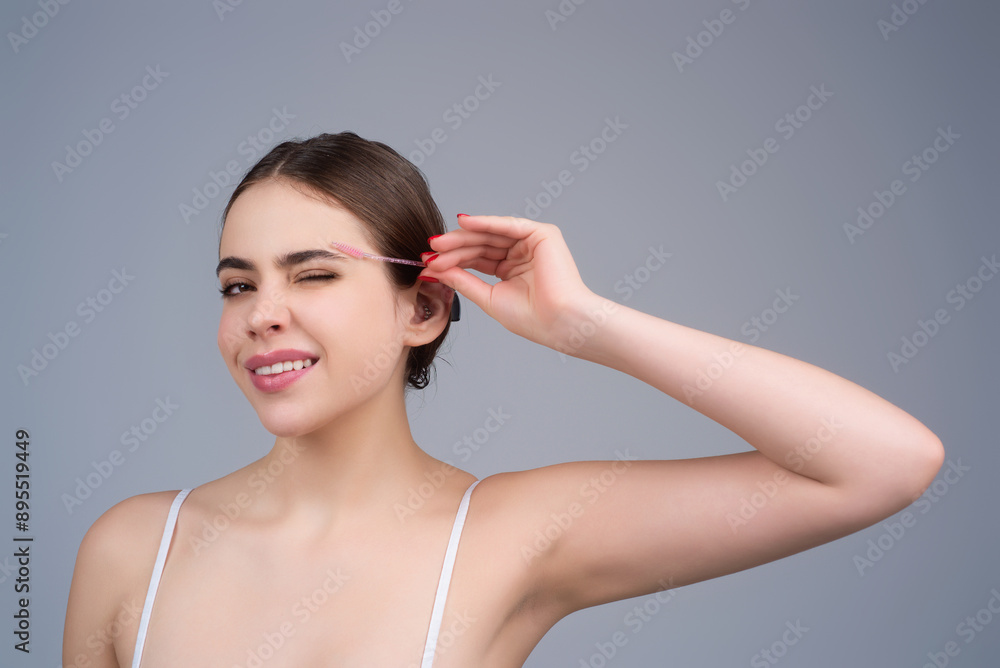 Mascara eyebrows. Natural beauty brows. Eyebrows coloring and lamination. Woman combing eyebrows. Makeup and cosmetology concept. Eyebrow shape modeling. Mascara eyebrows. Natural beauty brows. Eyebrows coloring and lamination. Woman combing eyebrows. Makeup and cosmetology concept. Eyebrow shape modeling.
