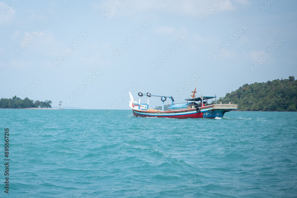 fishing boat on the sea with blue sky.
