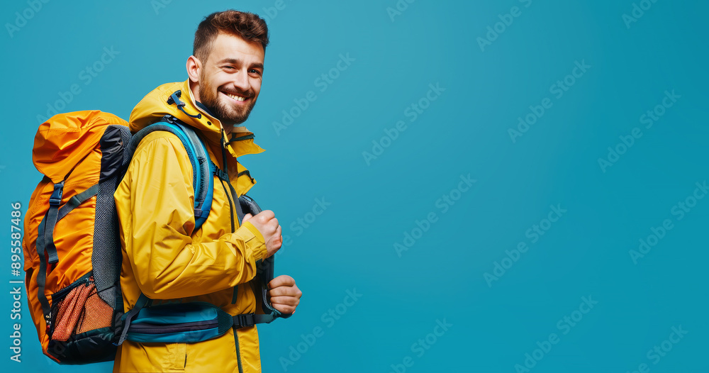 Portrait of attractive happy traveler man on a blue background. Portrait of attractive happy traveler man on a blue background.