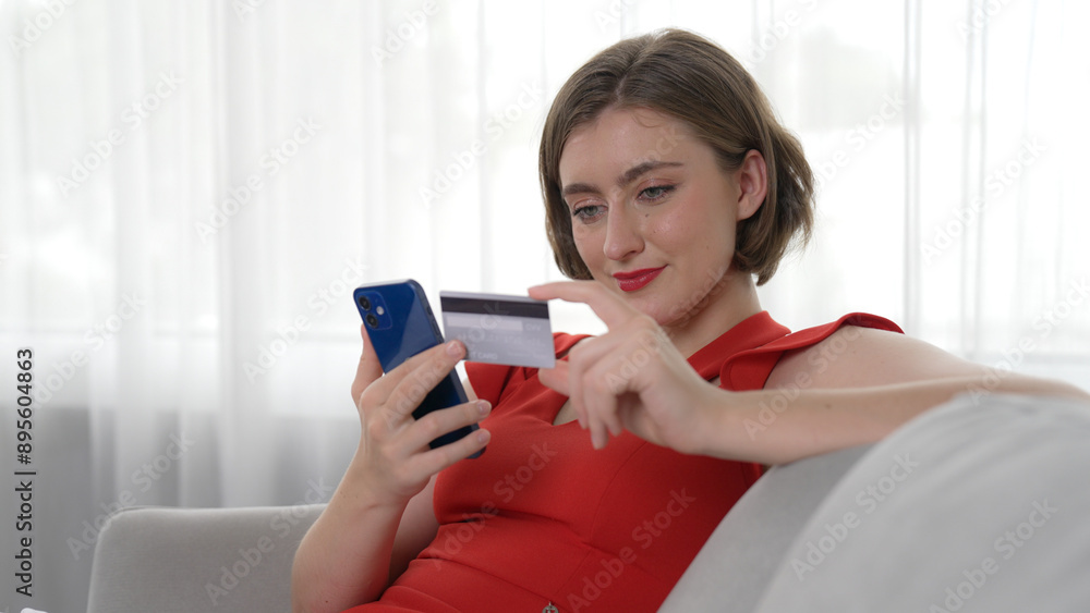 Woman shopping or pay online on internet marketplace browsing for sale items for modern lifestyle and use credit card for online payment from wallet protected by prim cyber security software Woman shopping or pay online on internet marketplace browsing for sale items for modern lifestyle and use credit card for online payment from wallet protected by prim cyber security software