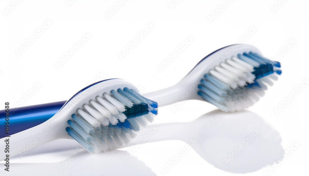 A modern toothbrush with soft bristles, isolated on a white background, emphasizing its clean and ergonomic design. A modern toothbrush with soft bristles, isolated on a white background, emphasizing its clean and ergonomic design.
