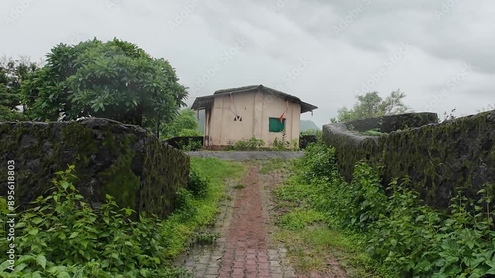 A quaint farmhouse surrounded by lush grass and trees under a cloudy sky, featuring a charming small cottage.
A quaint farmhouse surrounded by lush grass and trees under a cloudy sky, featuring a charming small cottage.