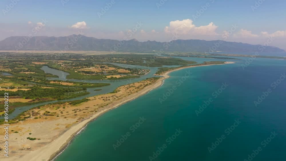 Aerial view of coastline with town and agricultural land of farmers. Luzon, Philippines. Aerial view of coastline with town and agricultural land of farmers. Luzon, Philippines.