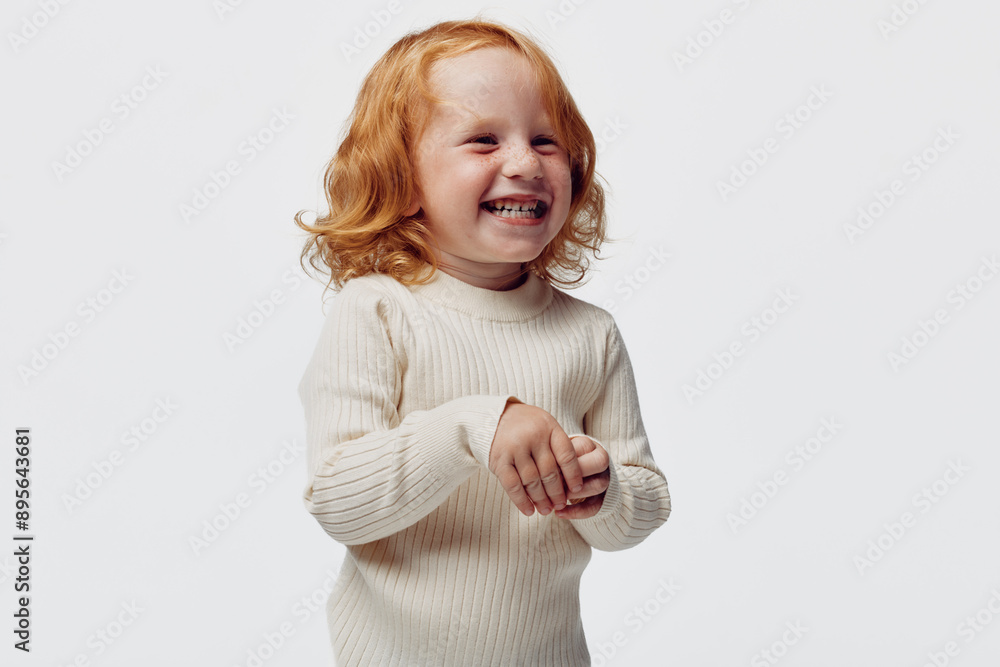 Happy little girl in white turtleneck sweater laughing, beauty and joy in childhood happiness, innocent laughter on winter day Happy little girl in white turtleneck sweater laughing, beauty and joy in childhood happiness, innocent laughter on winter day
