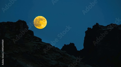 full moon at night between mountain 
