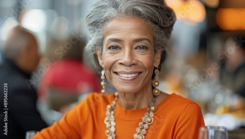 Smiling Woman In Orange Shirt At Restaurant