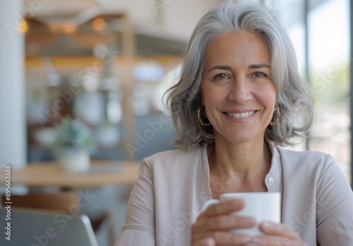 Woman Drinking Coffee at a Desk