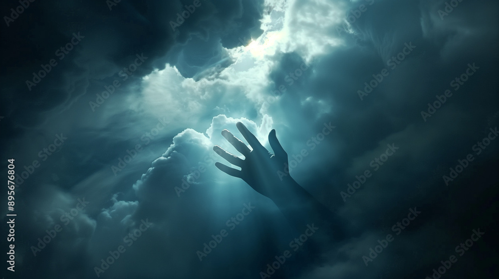 A hand reaching out from the darkness towards the heavenly light radiating through the clouds in the sky. A scene expressing hope for support and help.
A hand reaching out from the darkness towards the heavenly light radiating through the clouds in the sky. A scene expressing hope for support and help.