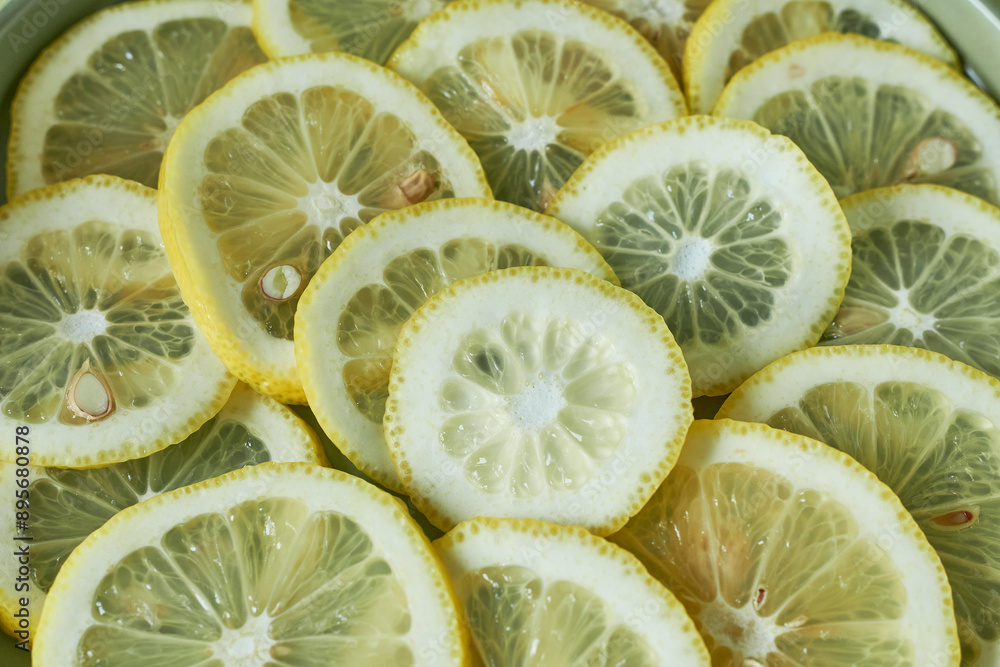 Lemon slices in a bowl. Close-up. Lemon slices in a bowl. Close-up.