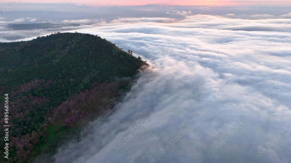Drone flying over sea of mist and mist in forest-covered mountains at sunrise. Drone flying over sea of mist and mist in forest-covered mountains at sunrise.