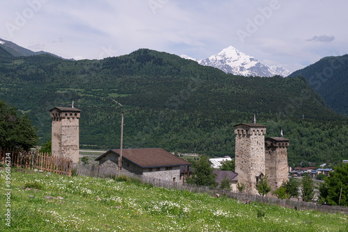 Mestia town in Georgia.
The medieval Svan Towers is a traditional fortified residence in Mestia, Georgia. Svan towers and structures surrounded by green colors. photo