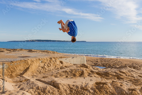 Somersault on beach