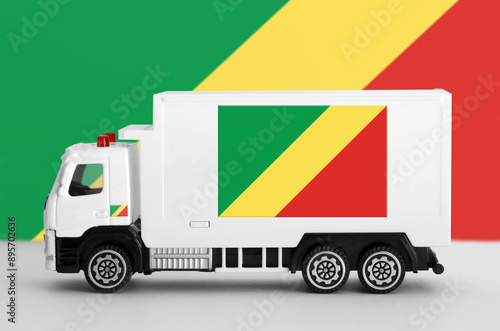 Congo flag depicted on side wall of white delivery van close up. Shipping and local delivery concept