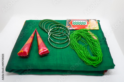 Shrawan Month Green Bangles, Mehendi Cones, Tika, Hair Flowers Gajra, necklace for Hindu Festival photo