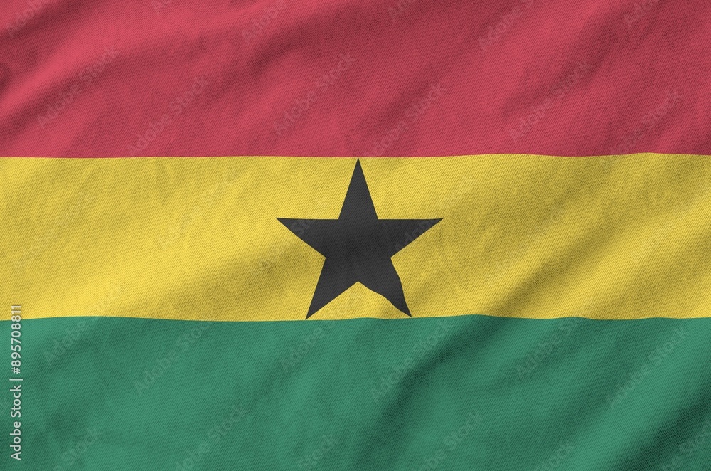 Ghana flag depicted on folded wavy fabric of old cloth close up Ghana flag depicted on folded wavy fabric of old cloth close up