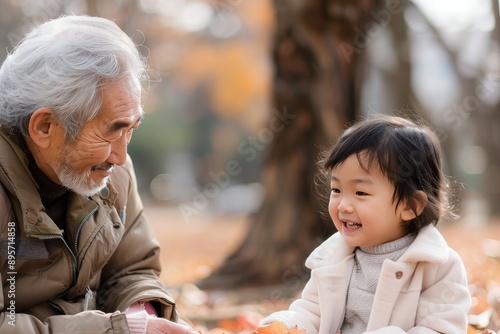 Elderly Man and Young Girl in Park