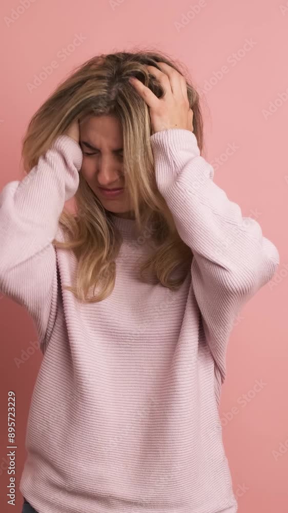 Woman gesturing headache hands on head Woman gesturing headache hands on head