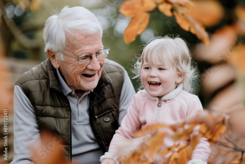 Grandfather and Granddaughter Laughing in Autumn
