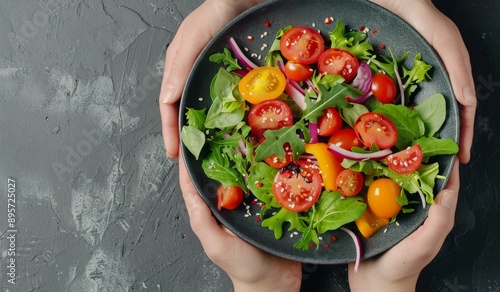 Hands Holding a Fresh Salad