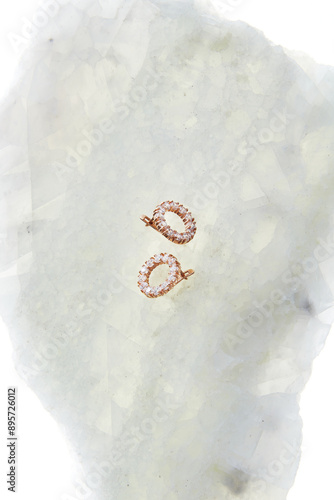 Elegant Gold Earrings with Diamonds on Marble Background