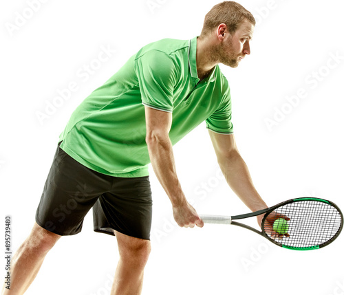 Concentered man, tennis player in sportswear serving ball with racket, playing isolated on transparent background. Concept of sport, competition, tournament, game, active lifestyle photo