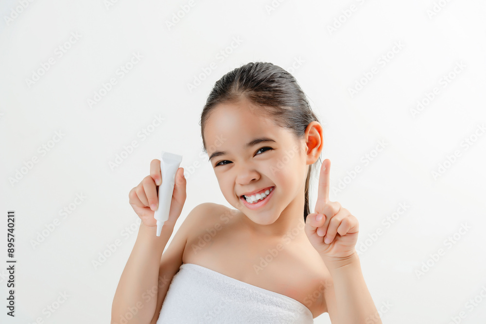 Adorable Girl Applying Facial Cream Smiling At Camera Adorable Girl Applying Facial Cream Smiling At Camera