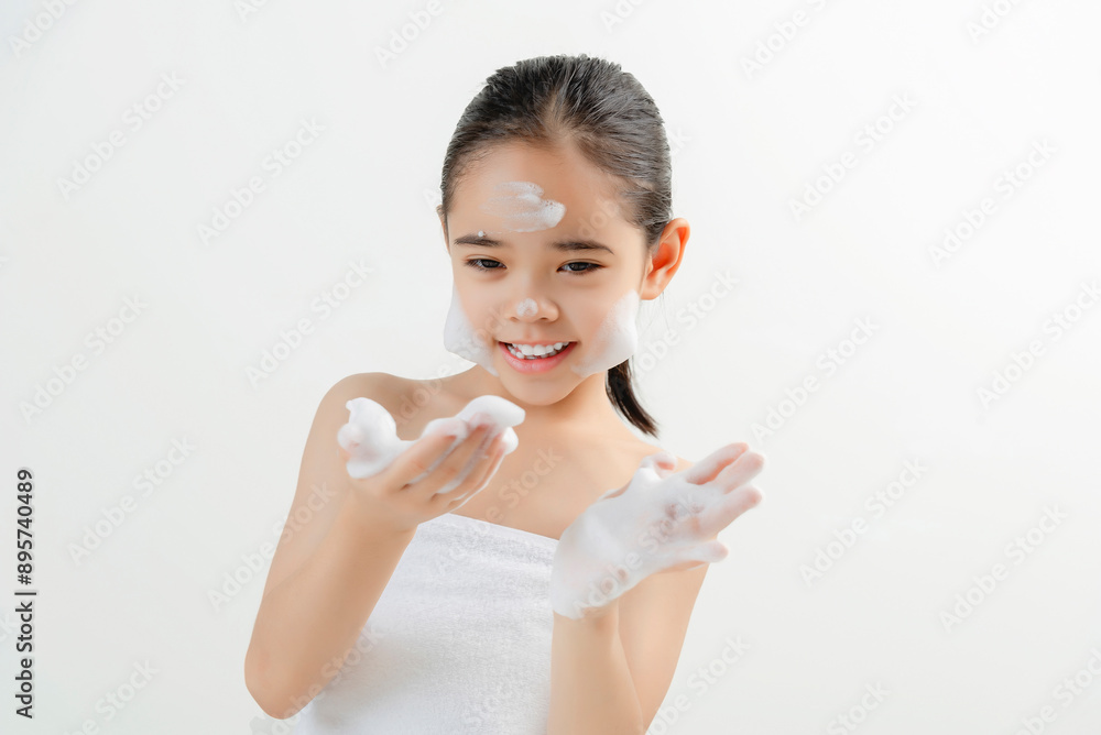 Adorable Girl Applying Facial Cream Smiling At Camera