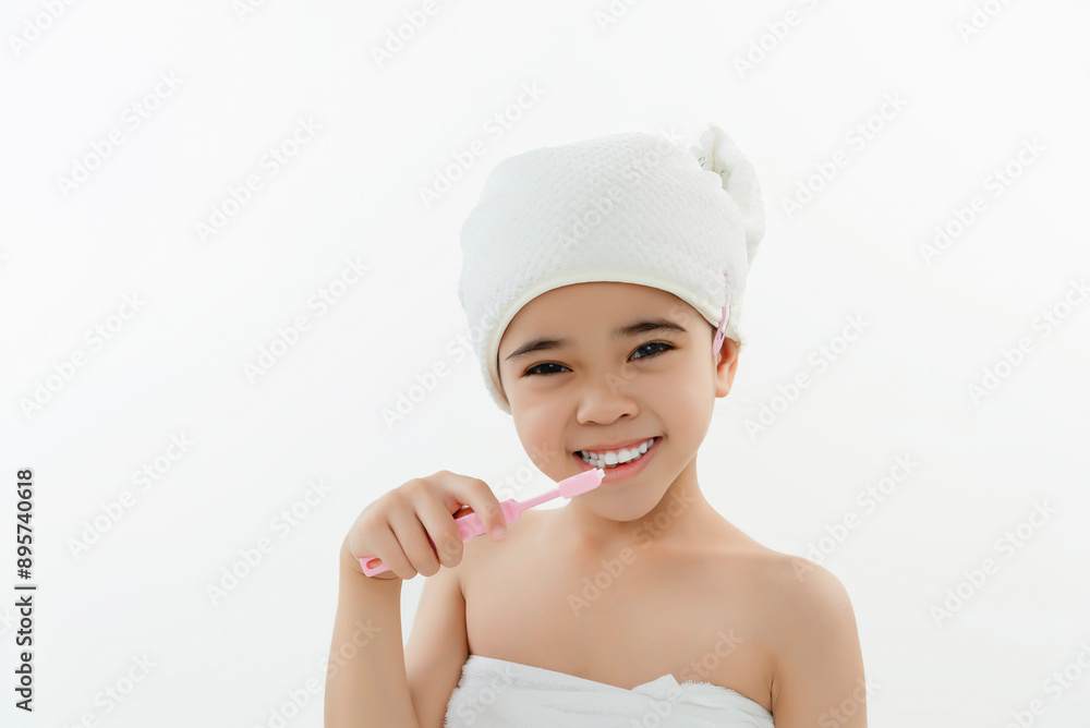 Smiling Child Brushing Teeth in Bathroom With Towel Wrap Smiling Child Brushing Teeth in Bathroom With Towel Wrap