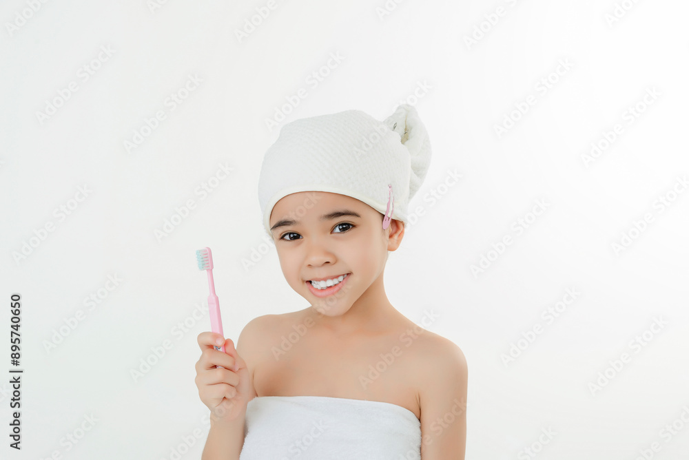 Smiling Child Brushing Teeth in Bathroom With Towel Wrap Smiling Child Brushing Teeth in Bathroom With Towel Wrap