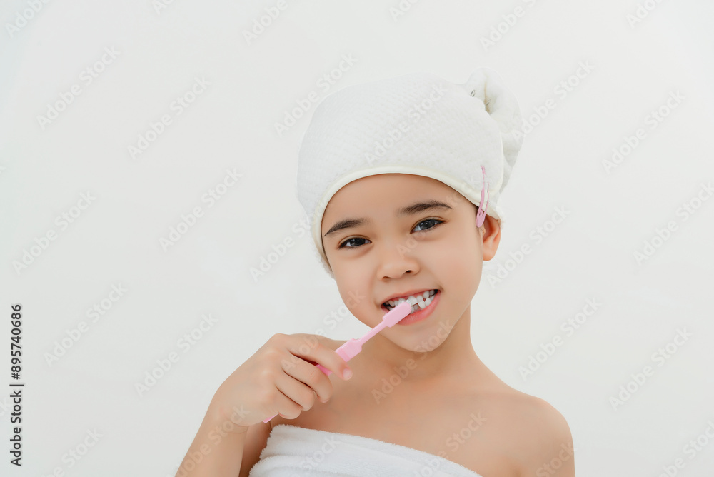 Smiling Child Brushing Teeth in Bathroom With Towel Wrap Smiling Child Brushing Teeth in Bathroom With Towel Wrap